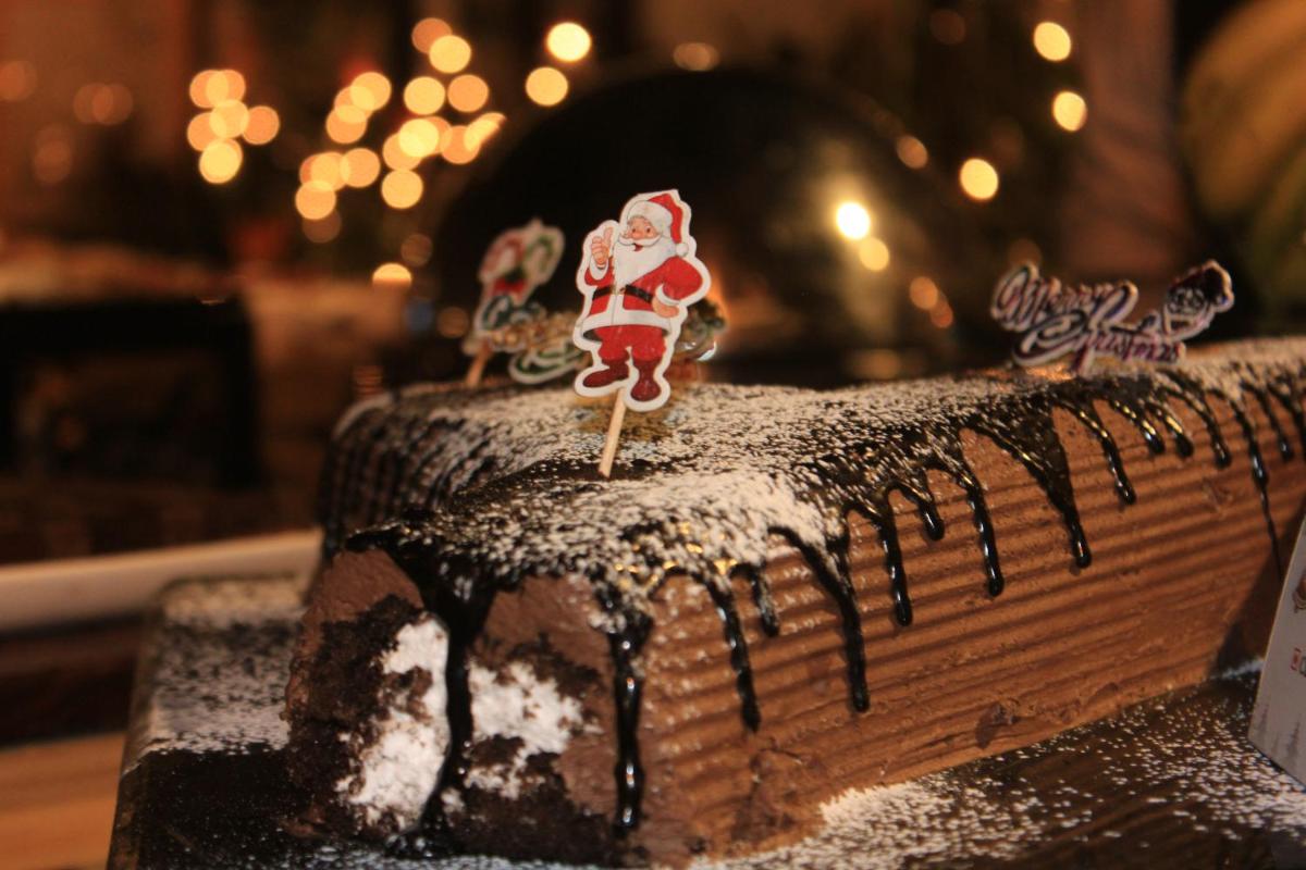 a chocolate cake with a santa clause on top of it at Savoy - IHCL SeleQtions in Ooty