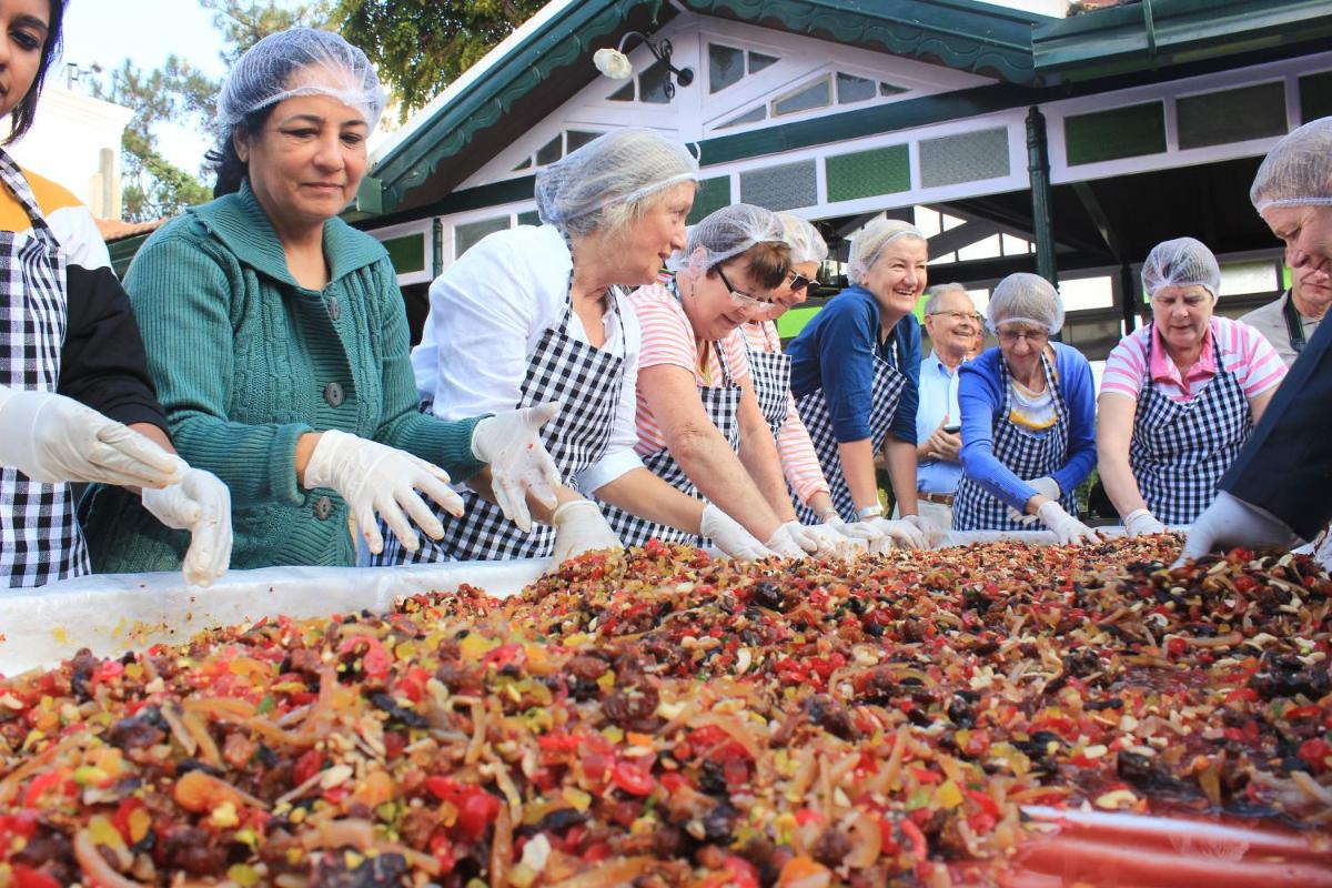 a group of people looking at a large pile of food at Savoy - IHCL SeleQtions in Ooty