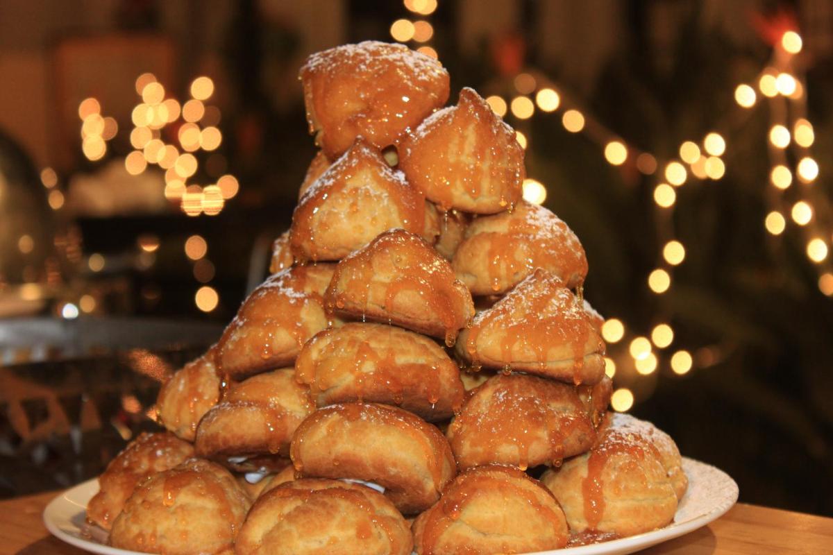 a pile of donuts on a plate on a table at Savoy - IHCL SeleQtions in Ooty