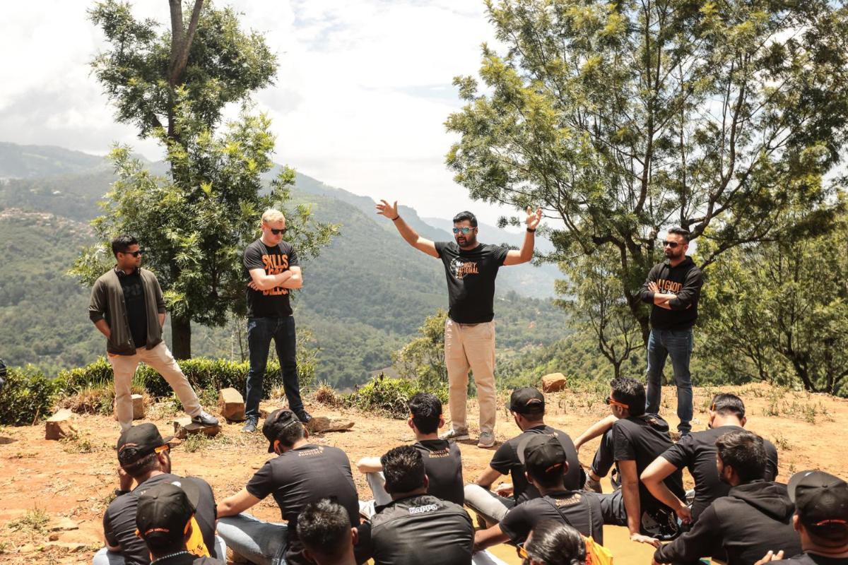 a group of men standing on top of a hill at Savoy - IHCL SeleQtions in Ooty