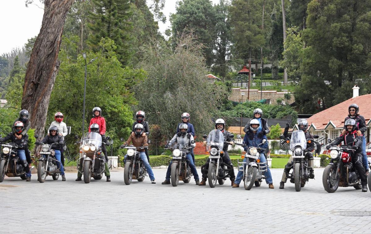 a group of people riding motorcycles on a street at Savoy - IHCL SeleQtions in Ooty
