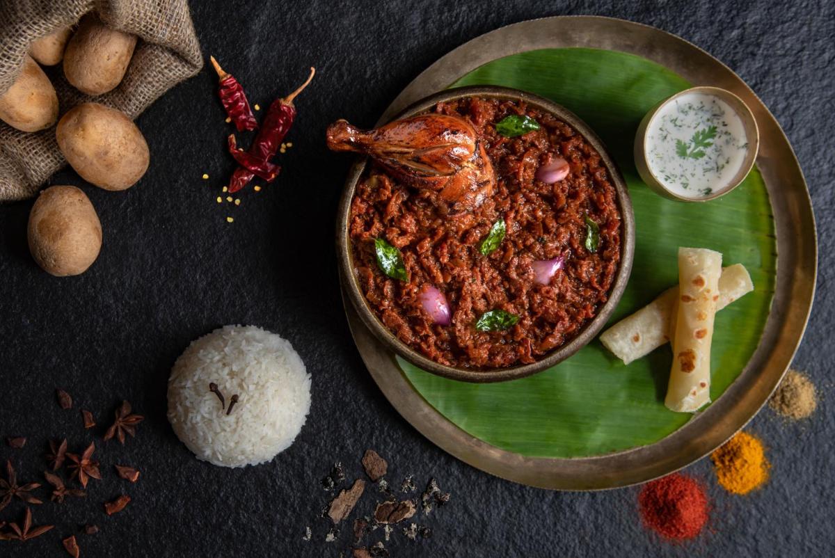 a plate of food with a bowl of food at Savoy - IHCL SeleQtions in Ooty