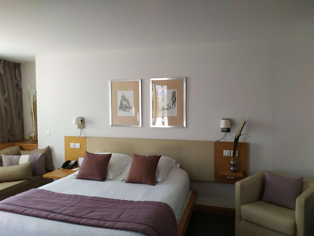 Un ou plusieurs lits dans un hébergement de l'établissement Best Western Premier Hôtel du Vieux-Port