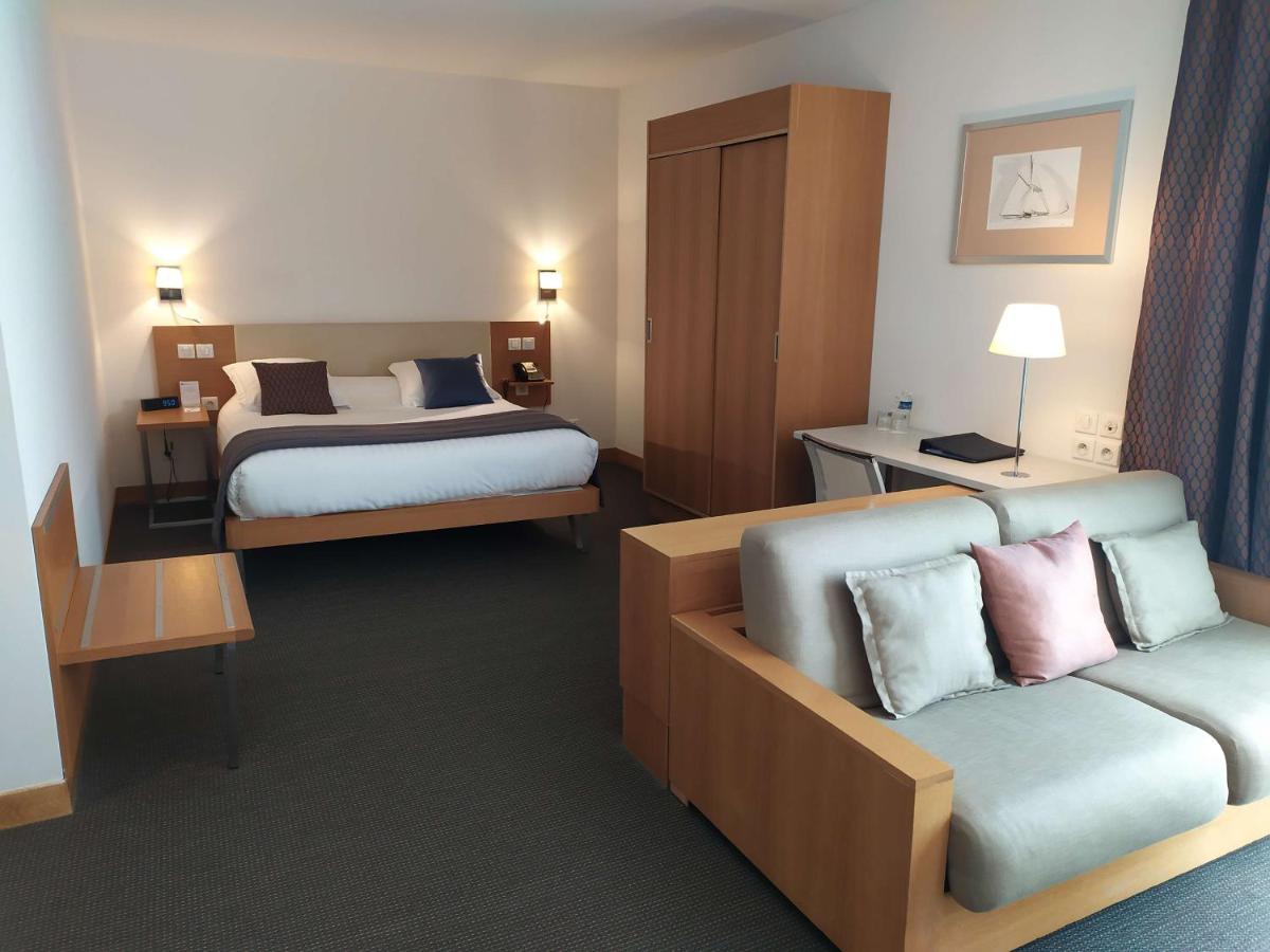 Un ou plusieurs lits dans un hébergement de l'établissement Best Western Premier Hôtel du Vieux-Port