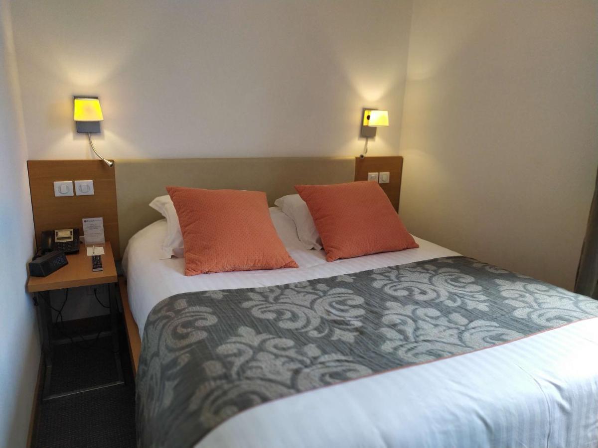 Un ou plusieurs lits dans un hébergement de l'établissement Best Western Premier Hôtel du Vieux-Port