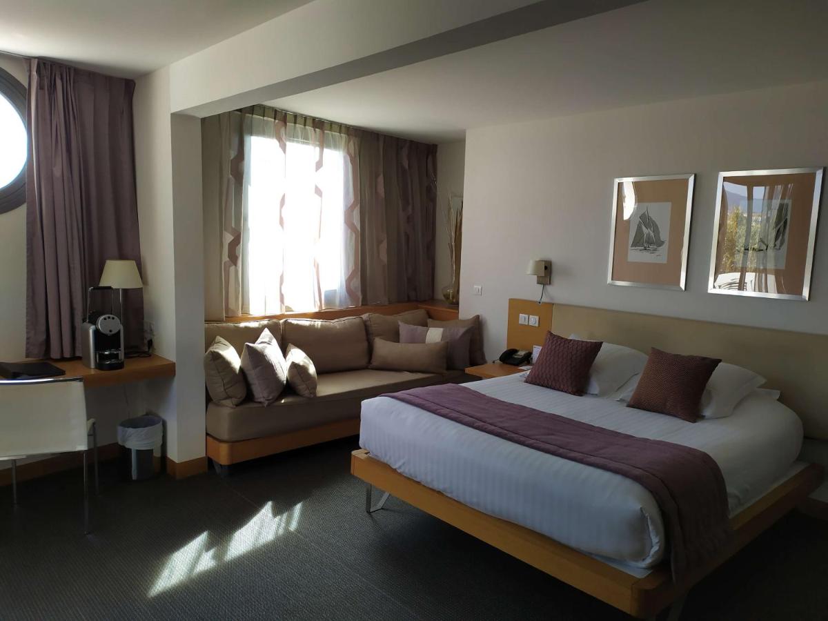 Un ou plusieurs lits dans un hébergement de l'établissement Best Western Premier Hôtel du Vieux-Port