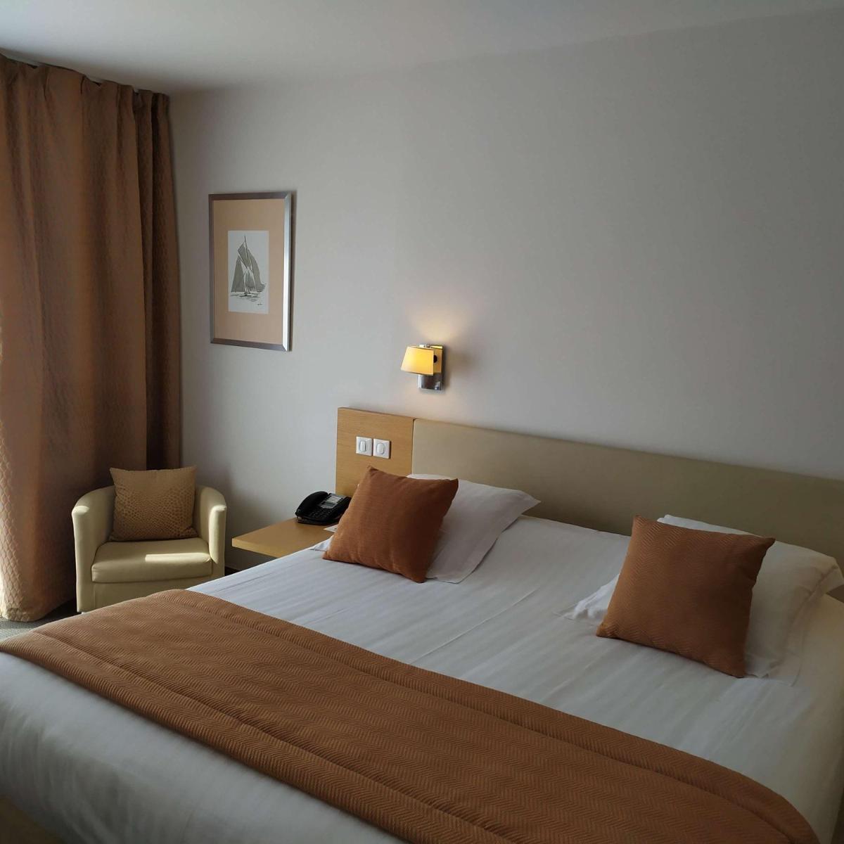 Un ou plusieurs lits dans un hébergement de l'établissement Best Western Premier Hôtel du Vieux-Port