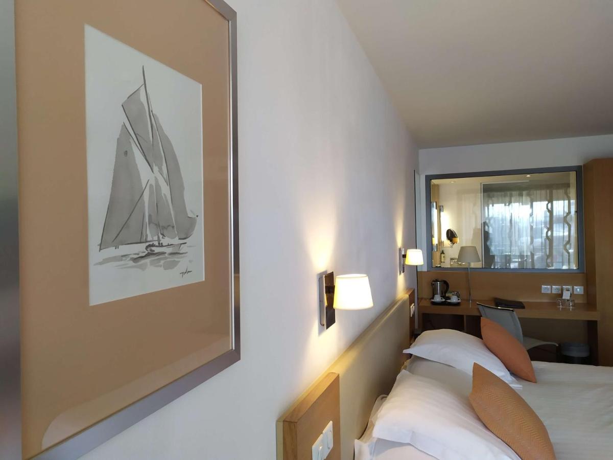 Un ou plusieurs lits dans un hébergement de l'établissement Best Western Premier Hôtel du Vieux-Port
