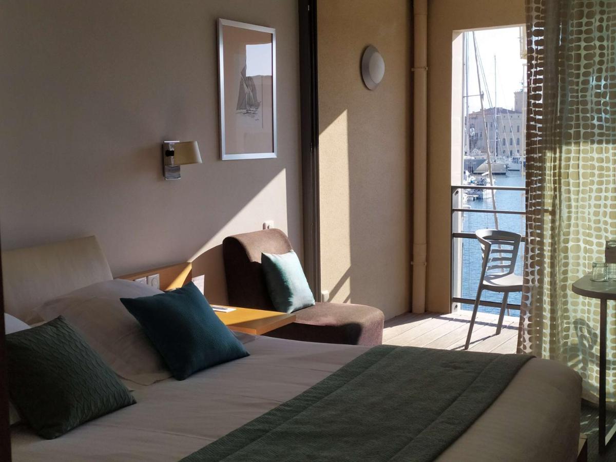 Un ou plusieurs lits dans un hébergement de l'établissement Best Western Premier Hôtel du Vieux-Port