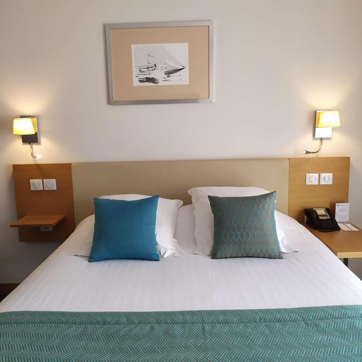 Un ou plusieurs lits dans un hébergement de l'établissement Best Western Premier Hôtel du Vieux-Port