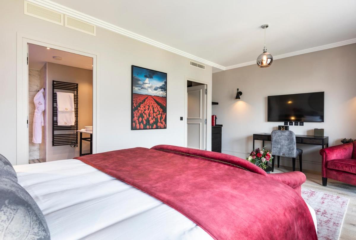 Un ou plusieurs lits dans un hébergement de l'établissement Hôtel L'Incomparable Aix-Les-Bains
