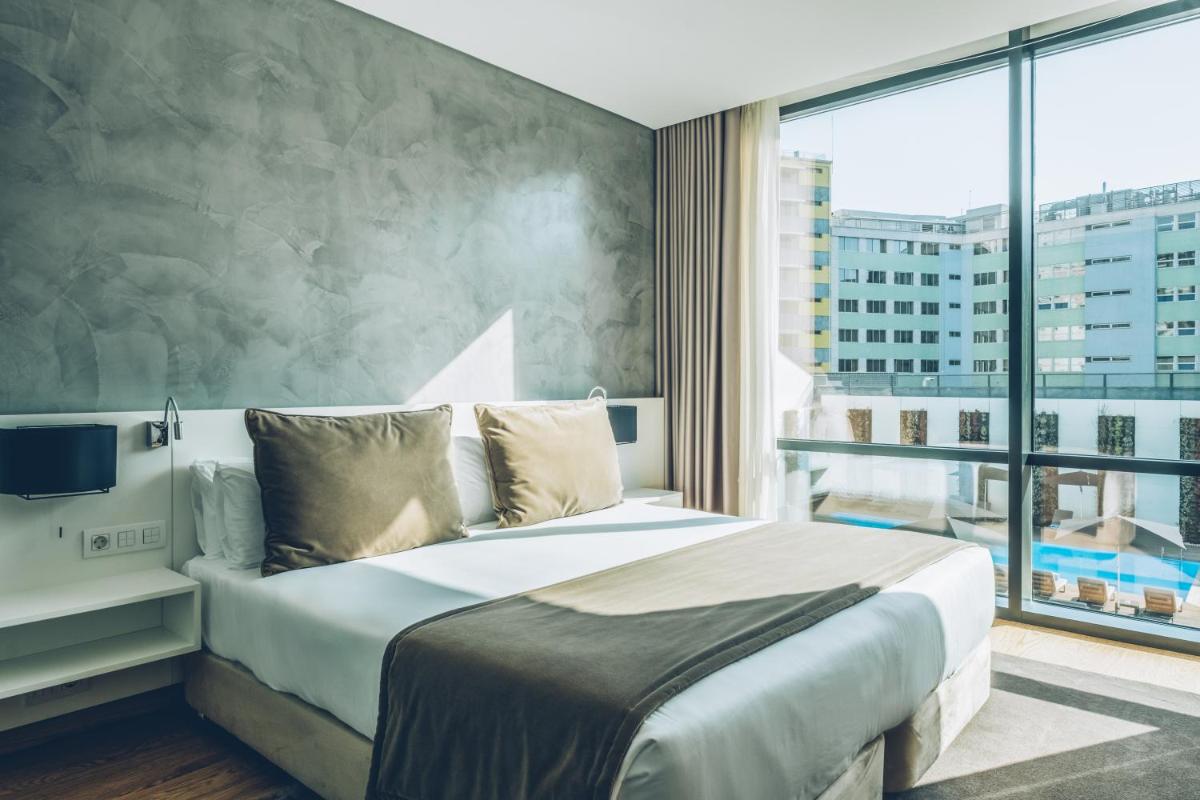 Uma cama ou camas num quarto em Iberostar Selection Lisboa