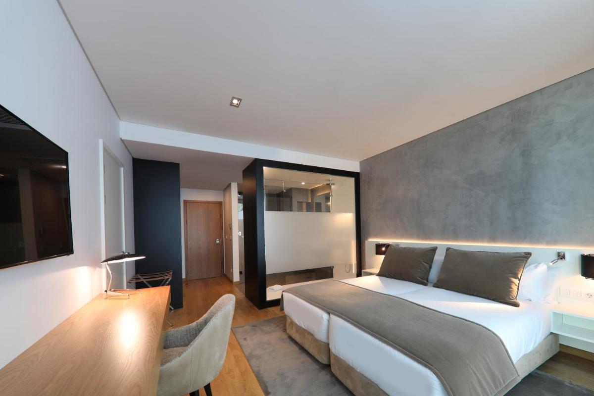 Uma cama ou camas num quarto em Iberostar Selection Lisboa