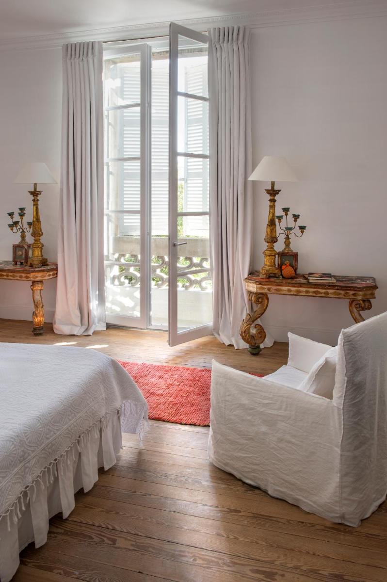Un ou plusieurs lits dans un hébergement de l'établissement L'Hôtel Particulier