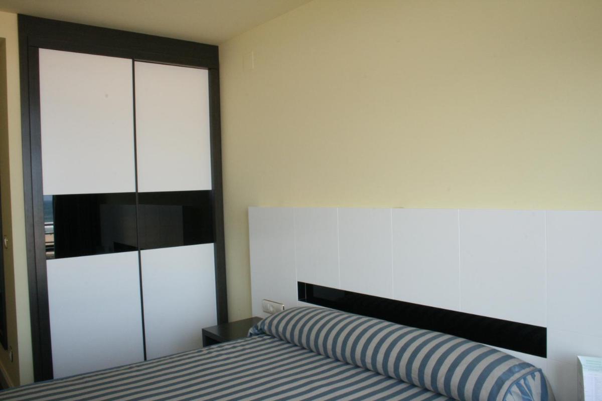 Cama o camas de una habitación en Hotel Playamar Spa