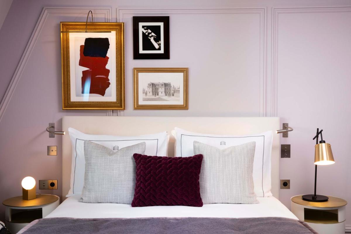 Un ou plusieurs lits dans un hébergement de l'établissement Le Damantin Hôtel & Spa