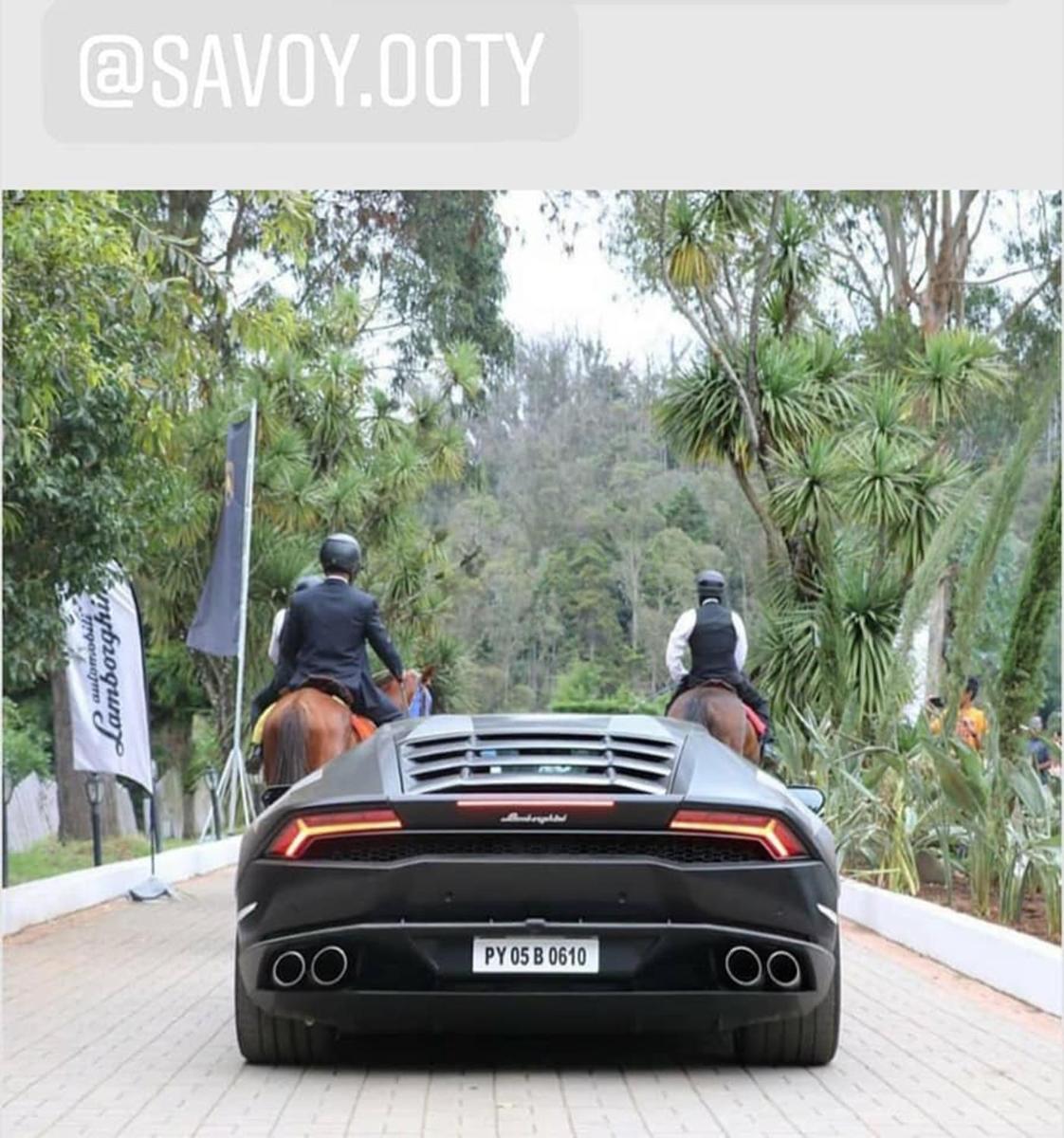two police officers riding on horses next to a car at Savoy - IHCL SeleQtions in Ooty