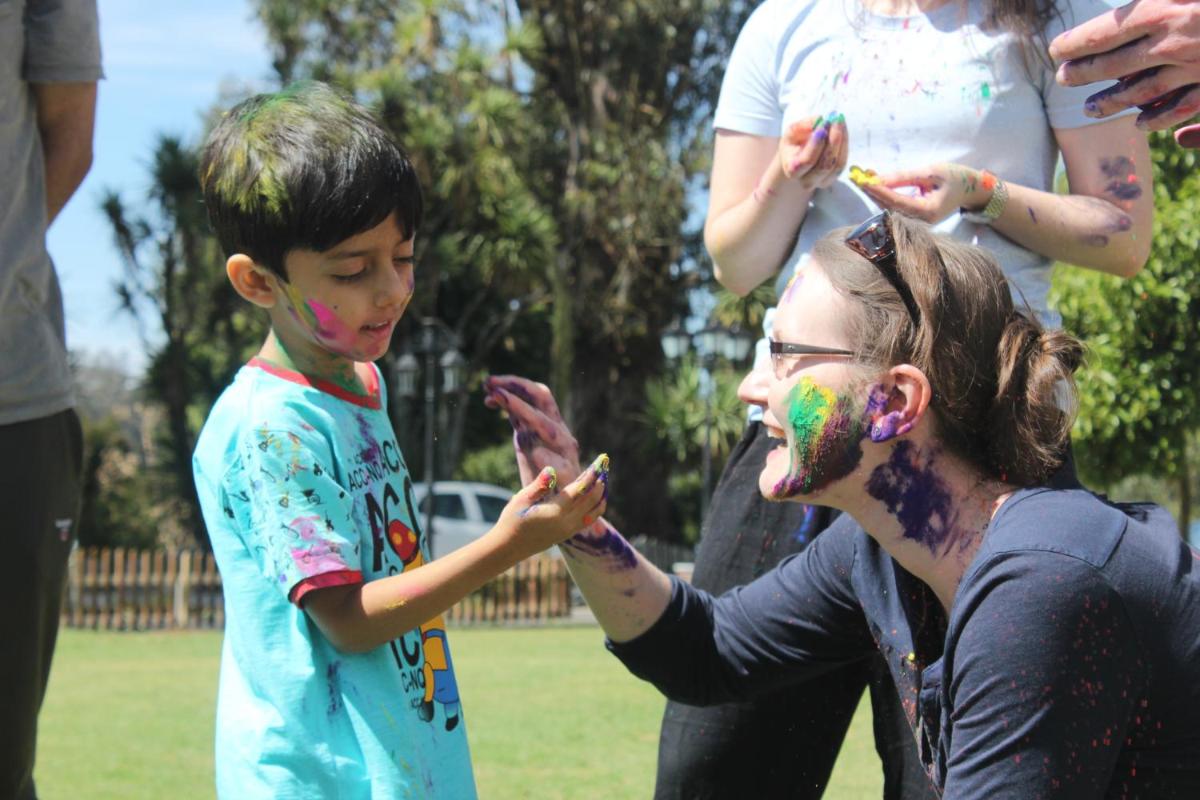 a woman and a child with paint on their face at Savoy - IHCL SeleQtions in Ooty