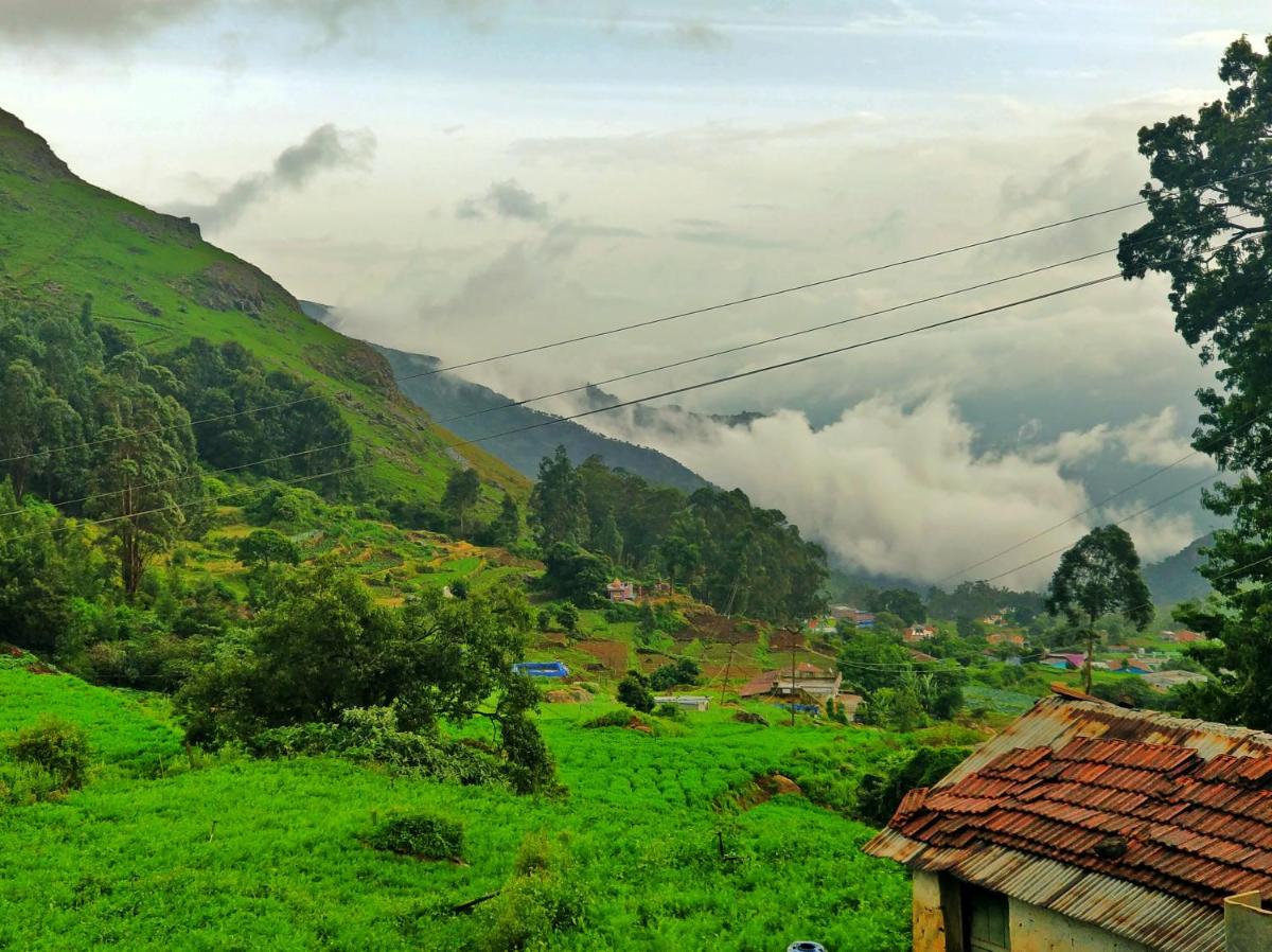 a view of a green valley with at Savoy - IHCL SeleQtions in Ooty