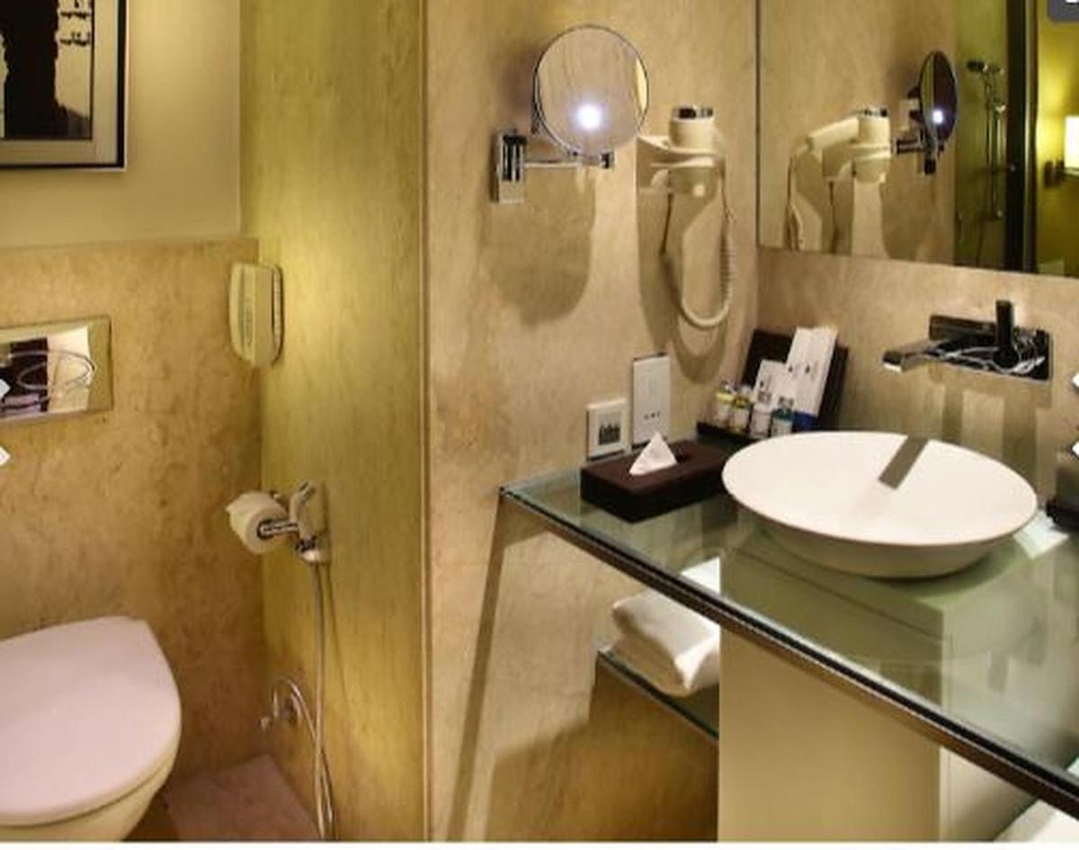 a bathroom with a sink and a toilet at Park Plaza Shahdara in New Delhi a bathroom with a sink and a toilet at Park Plaza Shahdara in New Delhi