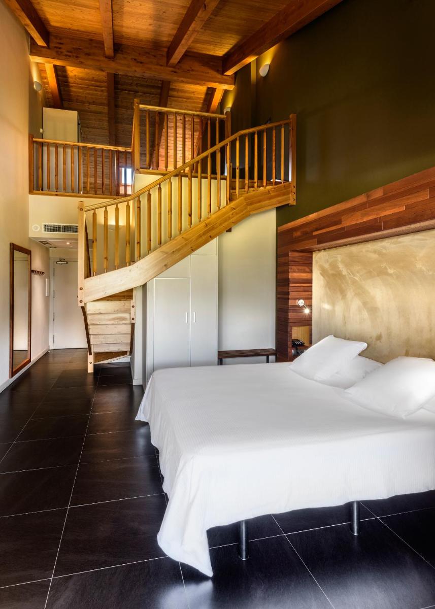 Cama o camas de una habitación en Hotel Spa Aguas de los Mallos
