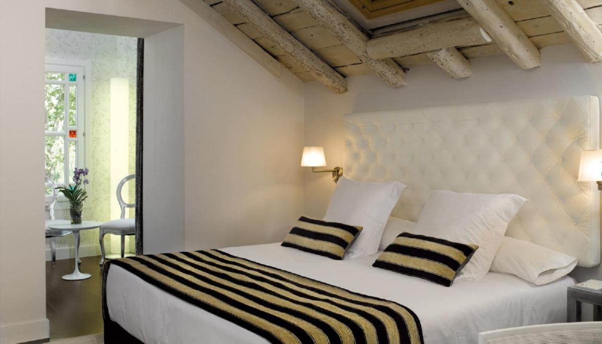 Cama o camas de una habitación en Hotel Villa Paulita