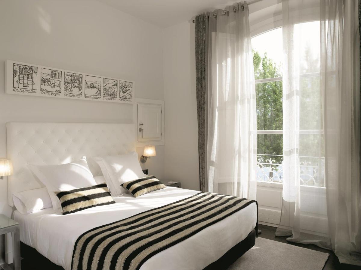 Cama o camas de una habitación en Hotel Villa Paulita