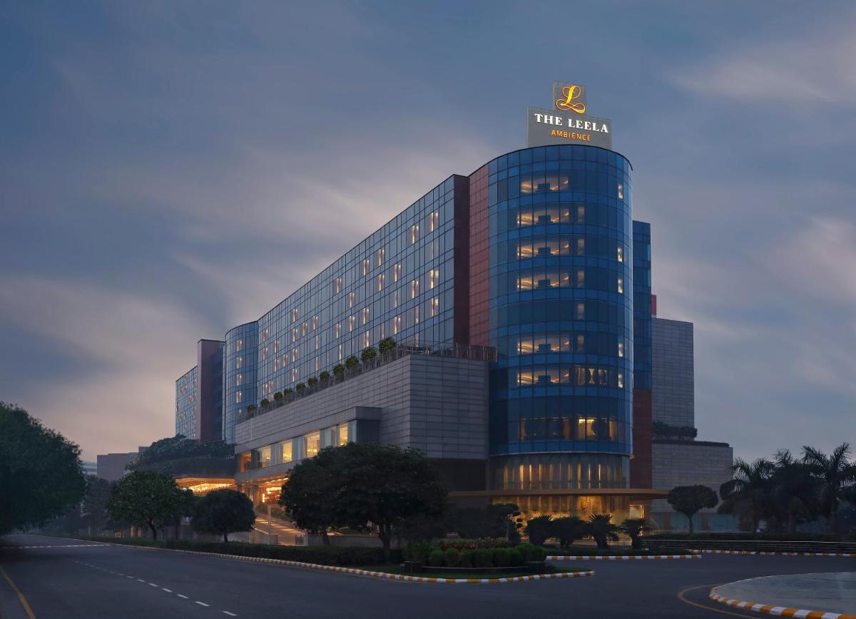 a building with a sign on the top of it at The Leela Ambience Gurugram Hotel & Residences - The Luxury Urban Sanctuary in Gurgaon a building with a sign on the top of it at The Leela Ambience Gurugram Hotel & Residences - The Luxury Urban Sanctuary in Gurgaon
