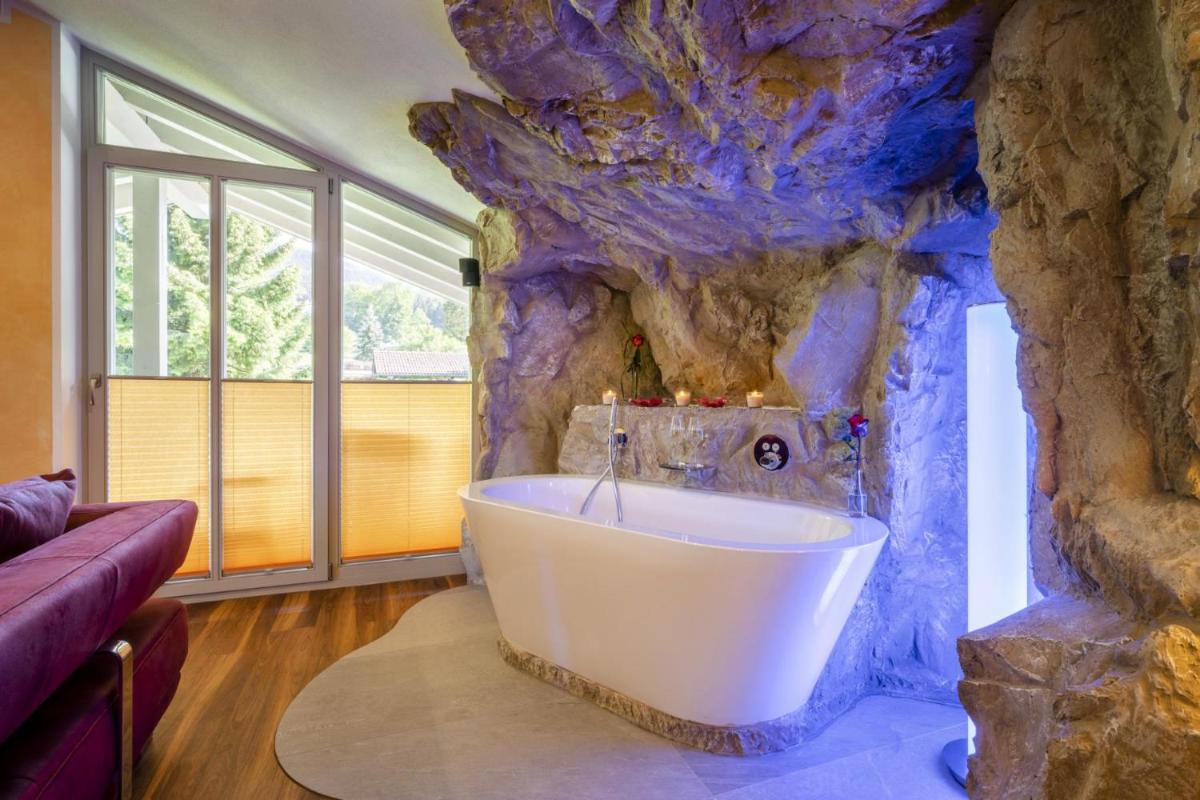 Ein Bett oder Betten in einem Zimmer der Unterkunft Alpenglühn Apartments - Adult Only