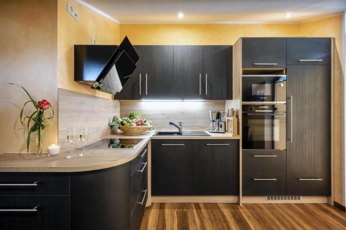 Küche/Küchenzeile in der Unterkunft Alpenglühn Apartments - Adult Only