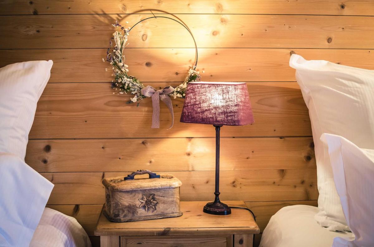 Un ou plusieurs lits dans un hébergement de l'établissement Chalet-Hôtel Hermitage