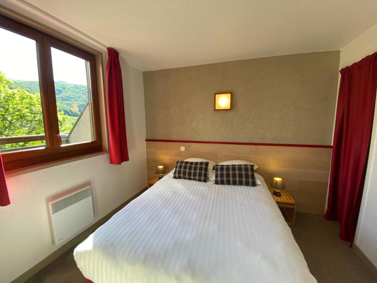 Un ou plusieurs lits dans un hébergement de l'établissement Sancy Resort