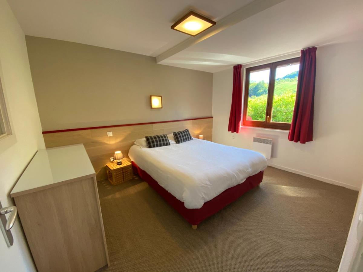 Un ou plusieurs lits dans un hébergement de l'établissement Sancy Resort
