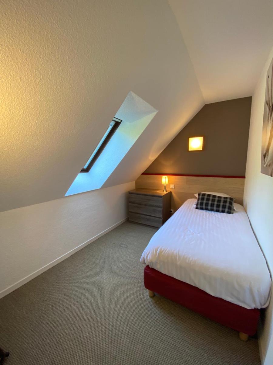 Un ou plusieurs lits dans un hébergement de l'établissement Sancy Resort