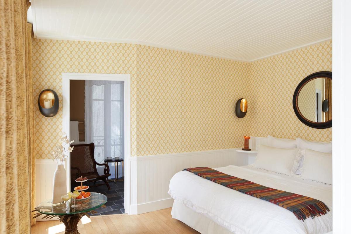 Un ou plusieurs lits dans un hébergement de l'établissement Grand Hotel Soleil d'Or