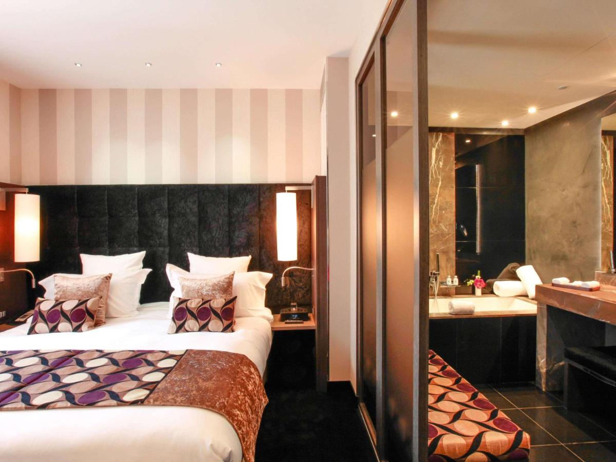 Un ou plusieurs lits dans un hébergement de l'établissement La Cour des Consuls Hotel & Spa Toulouse - MGallery Collection