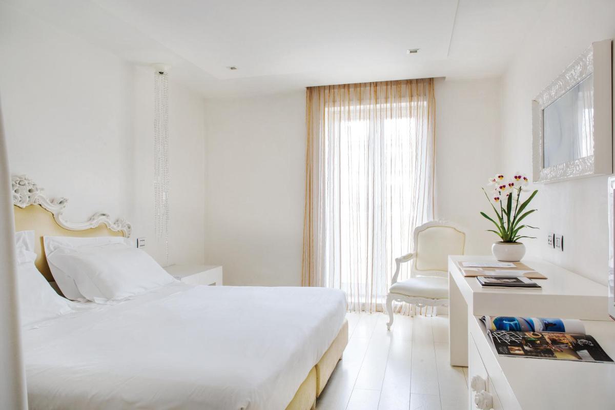 Un ou plusieurs lits dans un hébergement de l'établissement Boscolo Nice Hotel & Spa