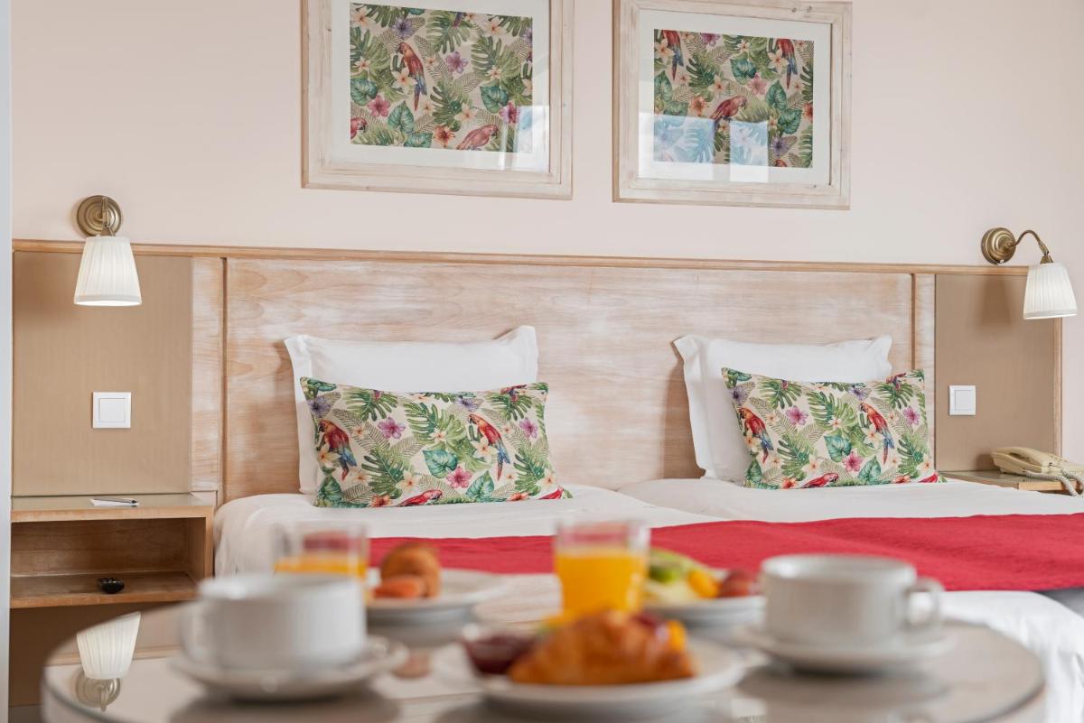 Uma cama ou camas num quarto em Dorisol Buganvilia Studio Hotel