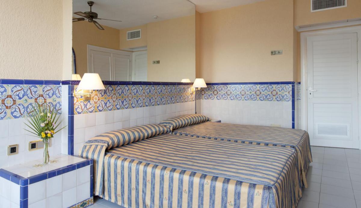Cama o camas de una habitación en Playalinda