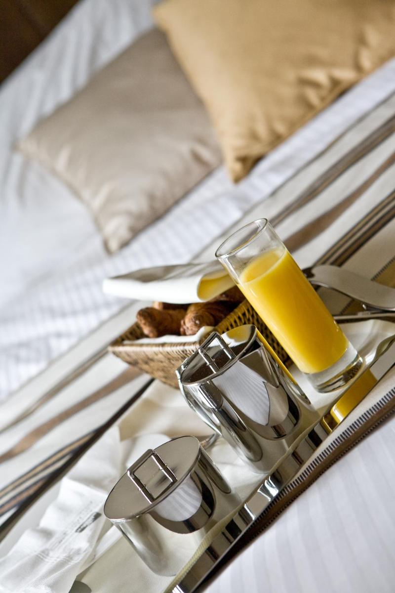 Un ou plusieurs lits dans un hébergement de l'établissement Best Western Plus Hotel des Francs