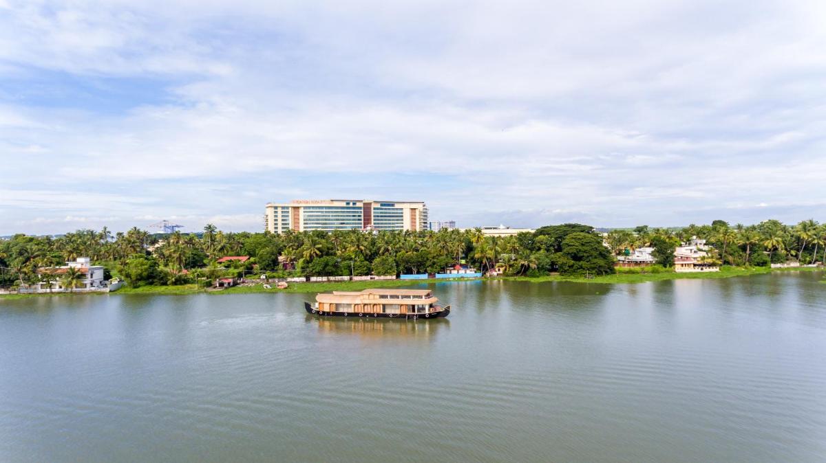 a boat in the middle of a large lake at Grand Hyatt Kochi Bolgatty in Cochin