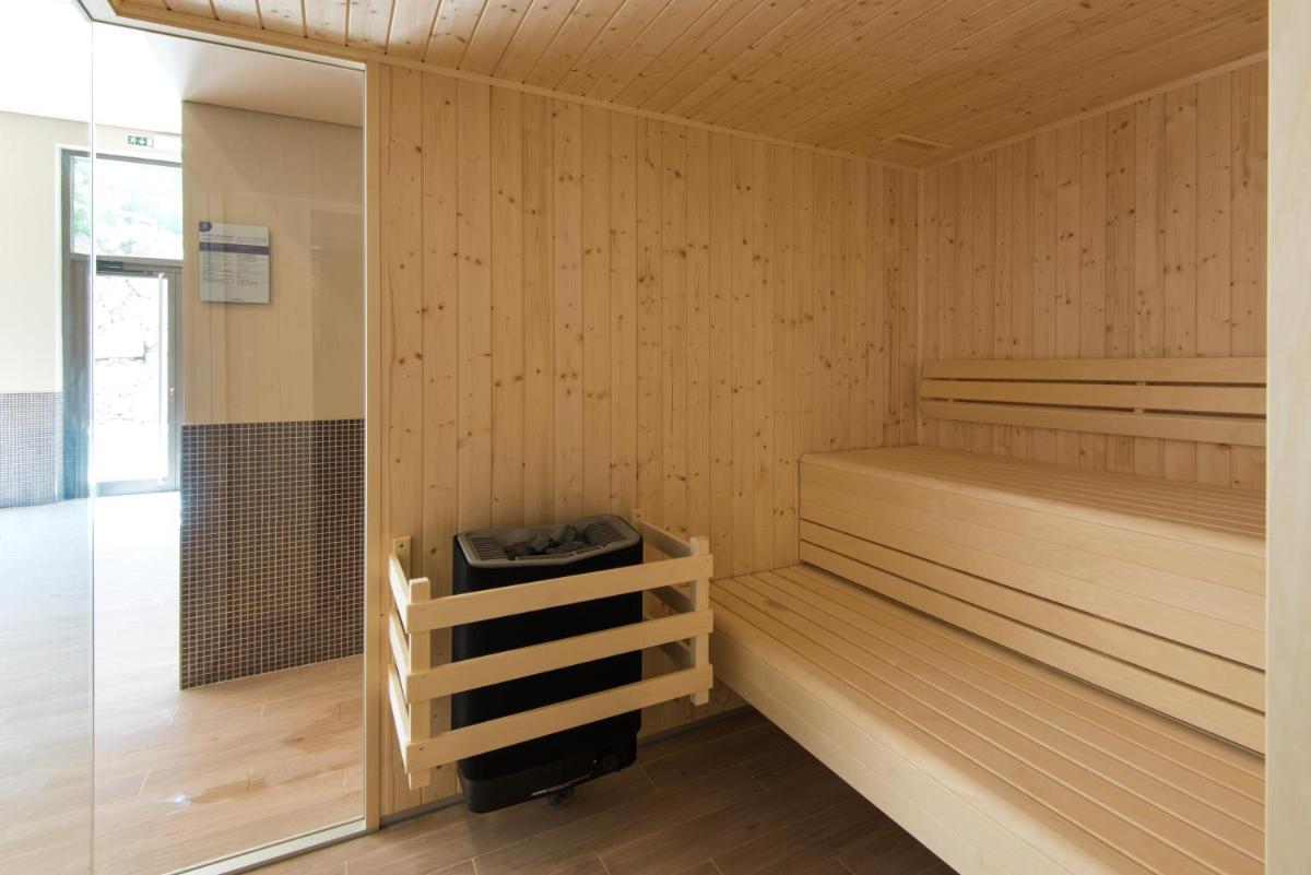 Uma cama ou camas num quarto em Vila Galé Collection Serra da Estrela