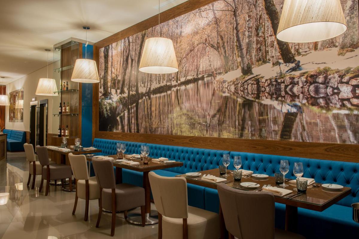 Um restaurante ou outro lugar para comer em Vila Galé Collection Serra da Estrela