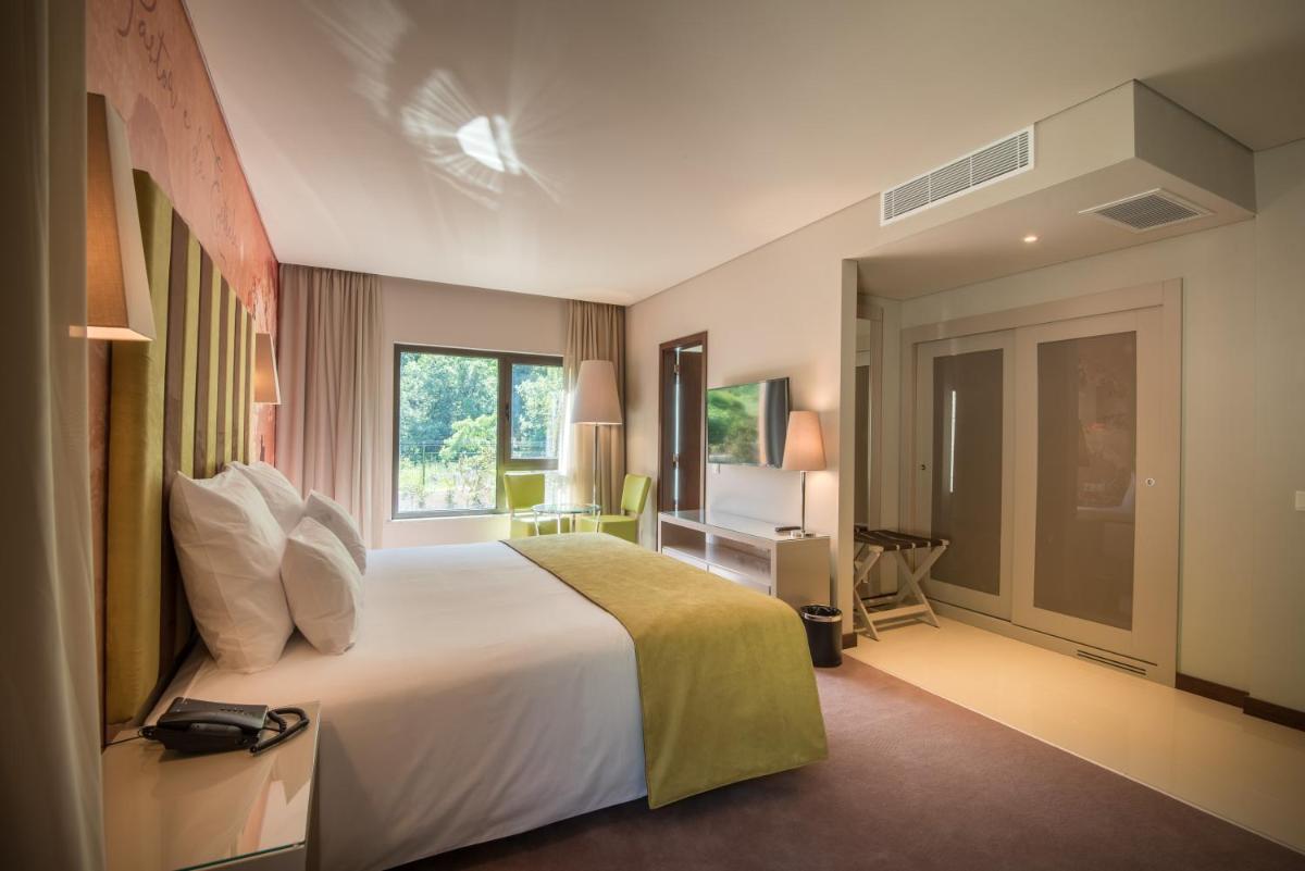 Uma cama ou camas num quarto em Vila Galé Collection Serra da Estrela