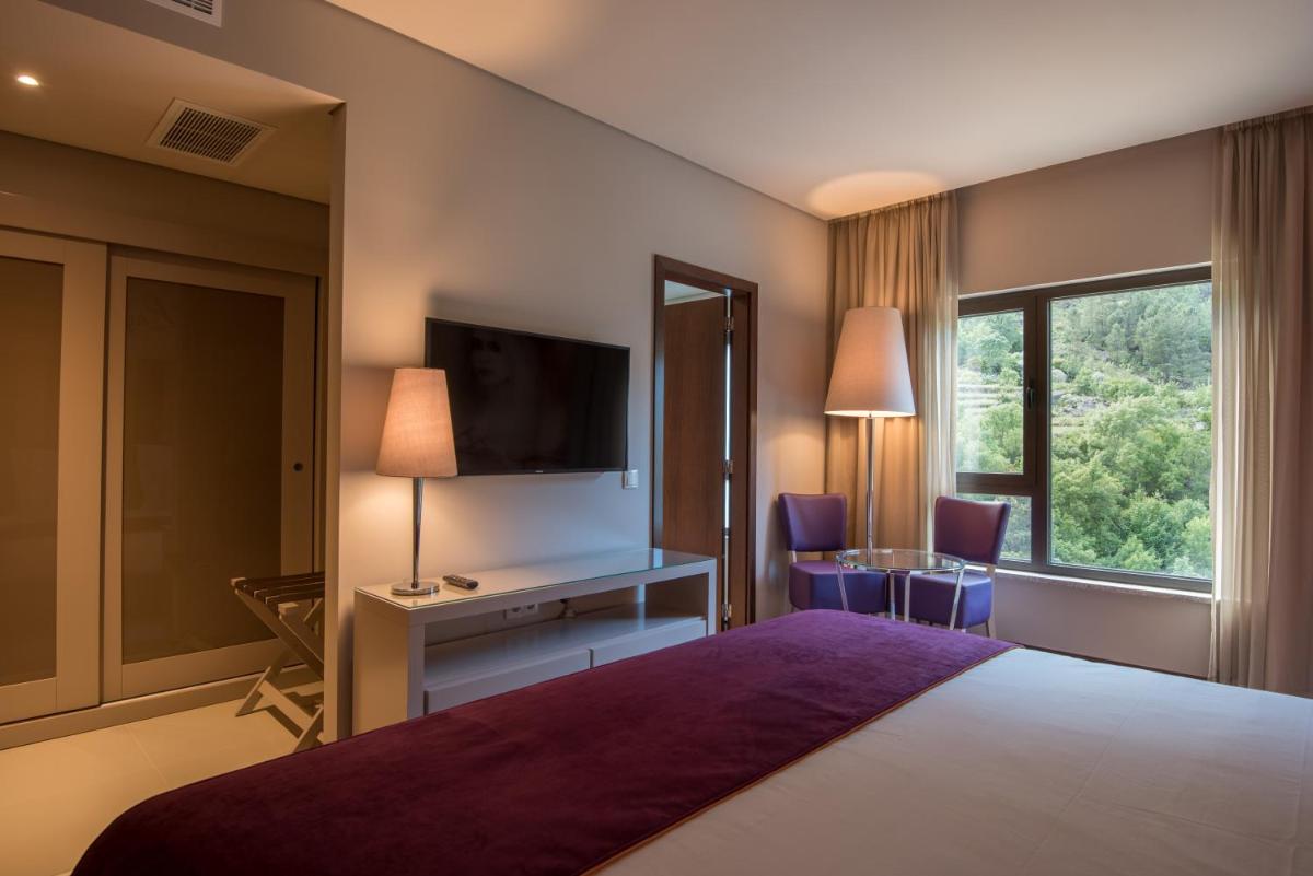 Uma cama ou camas num quarto em Vila Galé Collection Serra da Estrela
