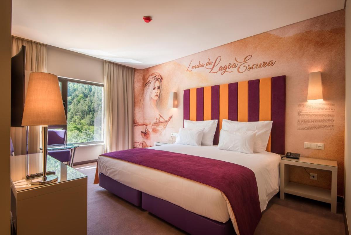 Uma cama ou camas num quarto em Vila Galé Collection Serra da Estrela