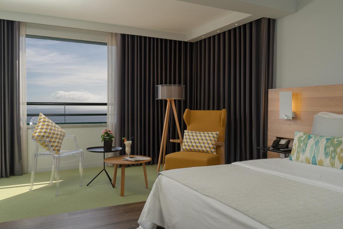 Uma cama ou camas num quarto em Madeira Panorâmico Hotel