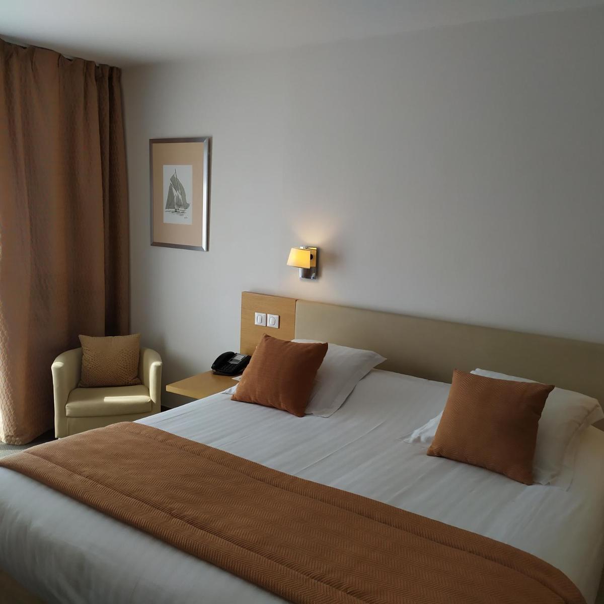 Un ou plusieurs lits dans un hébergement de l'établissement Best Western Premier Hôtel du Vieux-Port