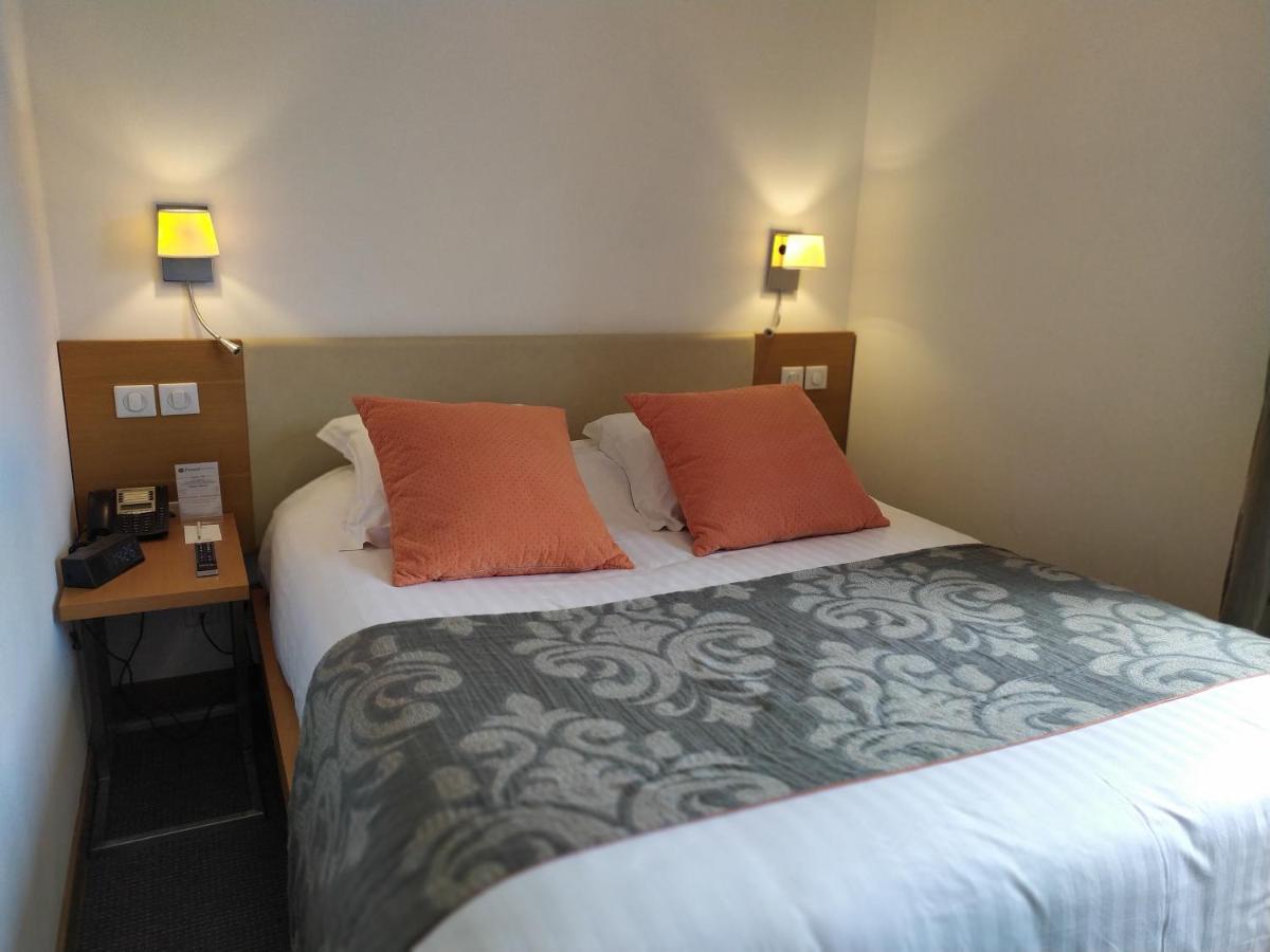 Un ou plusieurs lits dans un hébergement de l'établissement Best Western Premier Hôtel du Vieux-Port