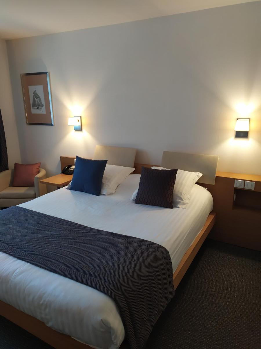 Un ou plusieurs lits dans un hébergement de l'établissement Best Western Premier Hôtel du Vieux-Port